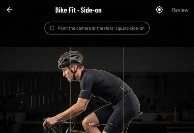 Llyr's Bike Fit screen with framing guides either side of the rider and a knee angle reading 148 degrees, ready to run the check again.